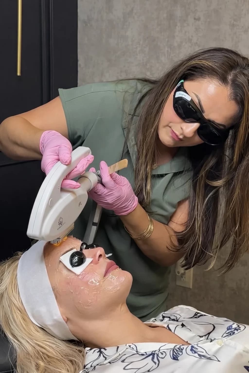 Angelica Alcaraz, BSN, RN, performing an IPL photofacial with the Spectrum IPL handpiece at Revive Beauty Bar in Salinas, CA, with protective eyewear worn by both provider and patient