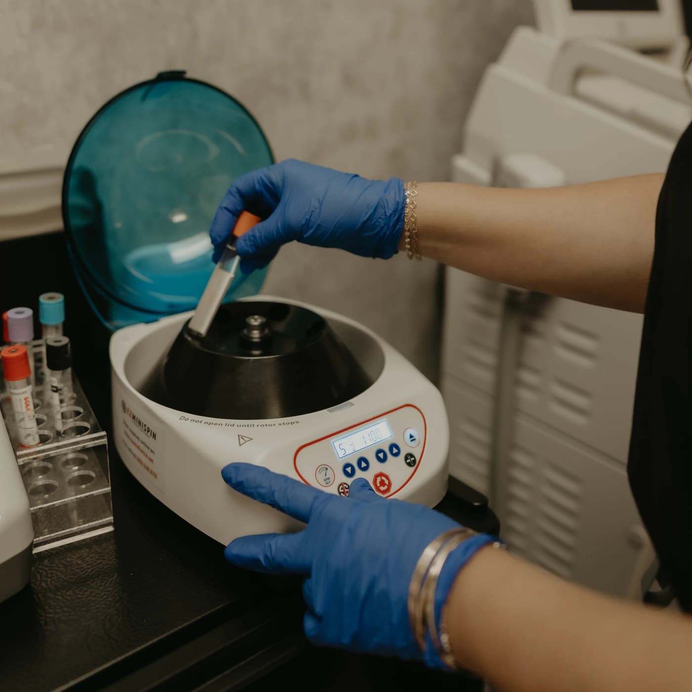 Angelica Alcaraz, BSN, RN, spinning a blood draw in the centrifuge to prepare PRF EZ Gel at Revive Beauty Bar in Salinas, CA